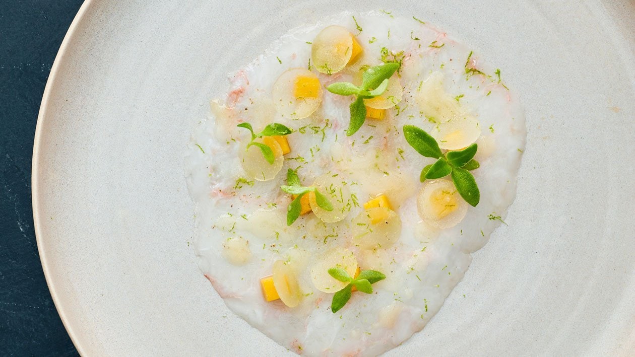 Carpaccio Langoustine met appel, mango en citrus – Recept